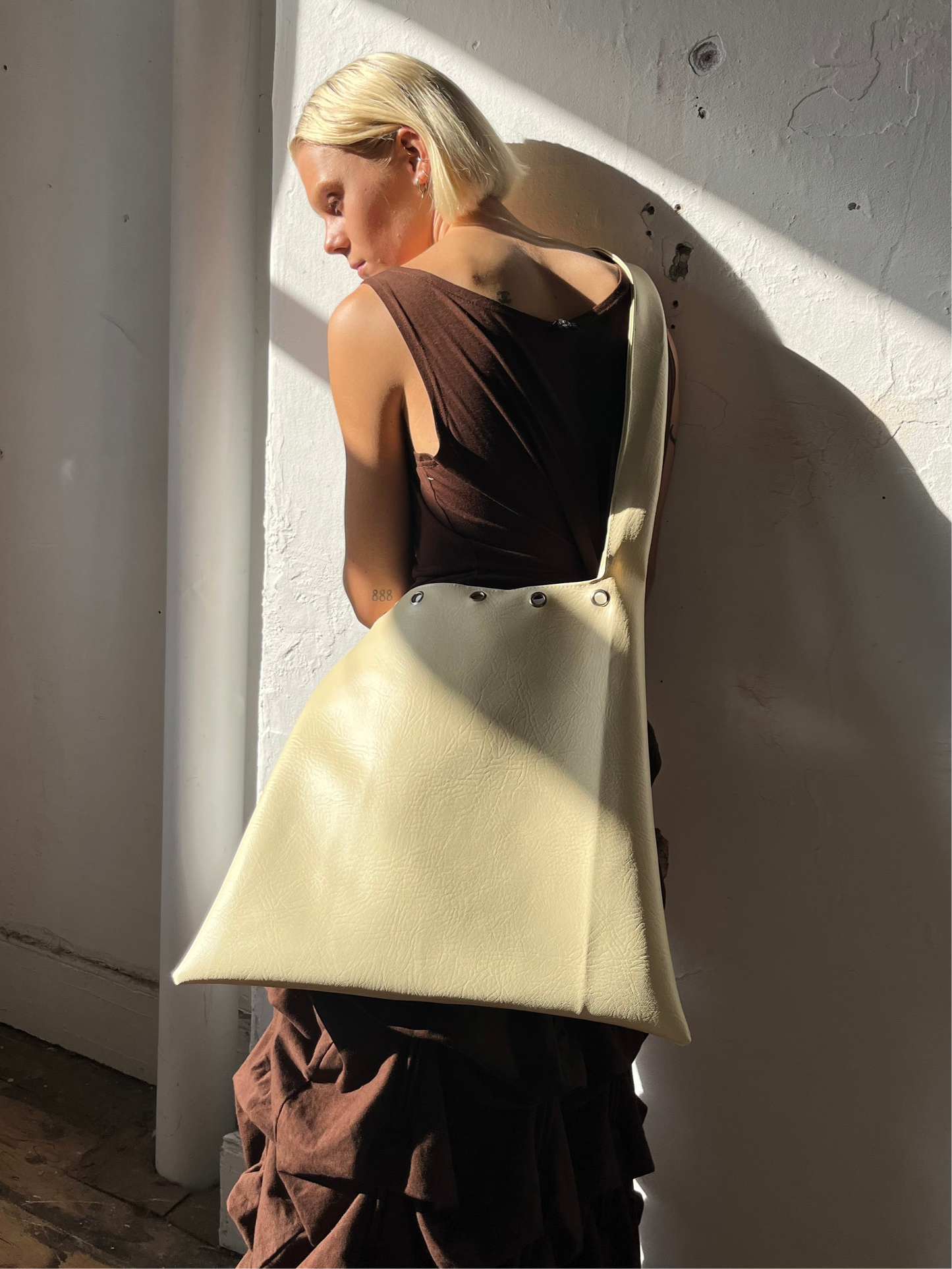 vanilla EYELET faux leather slouch bag