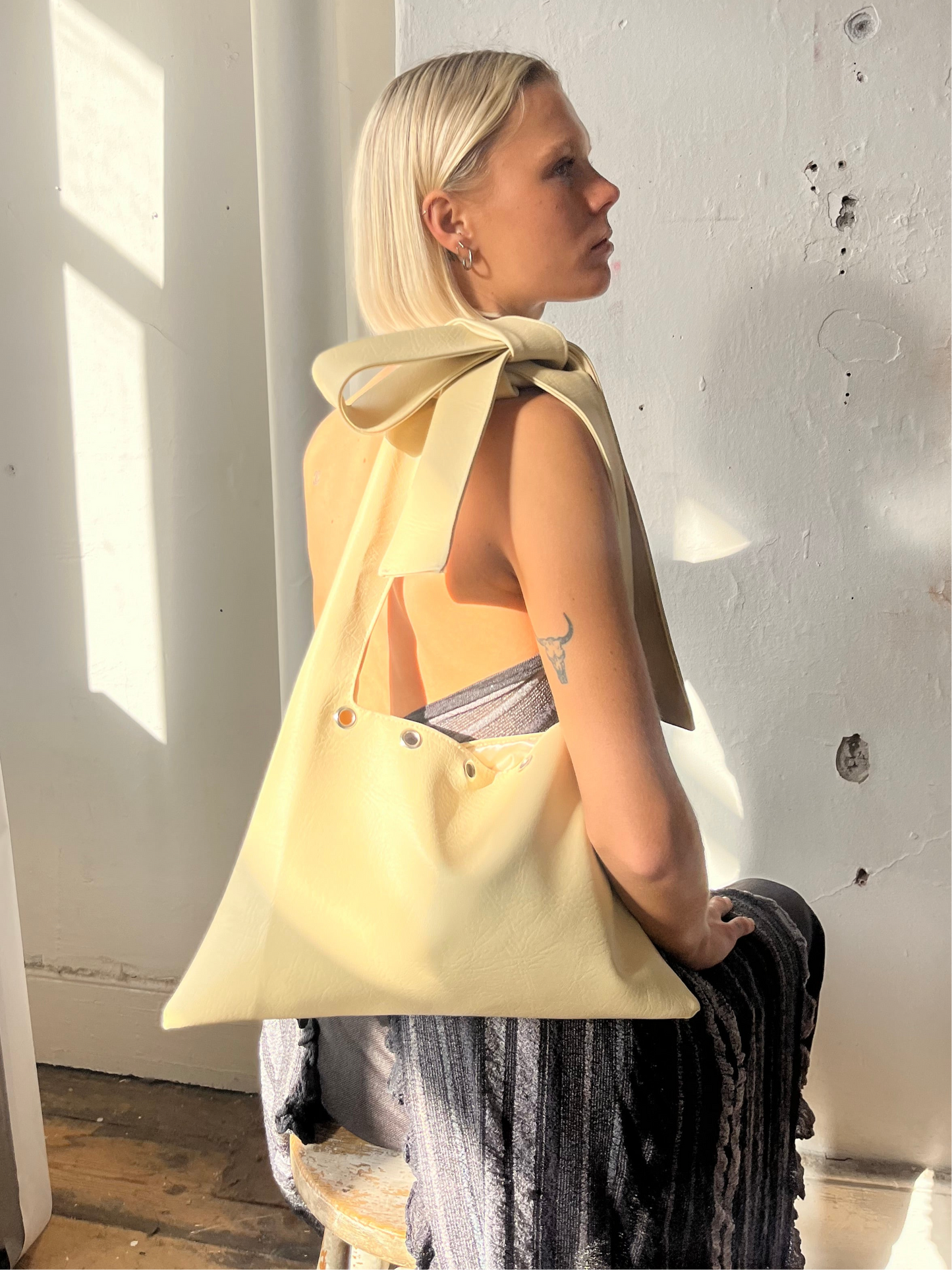 vanilla EYELET faux leather slouch bag