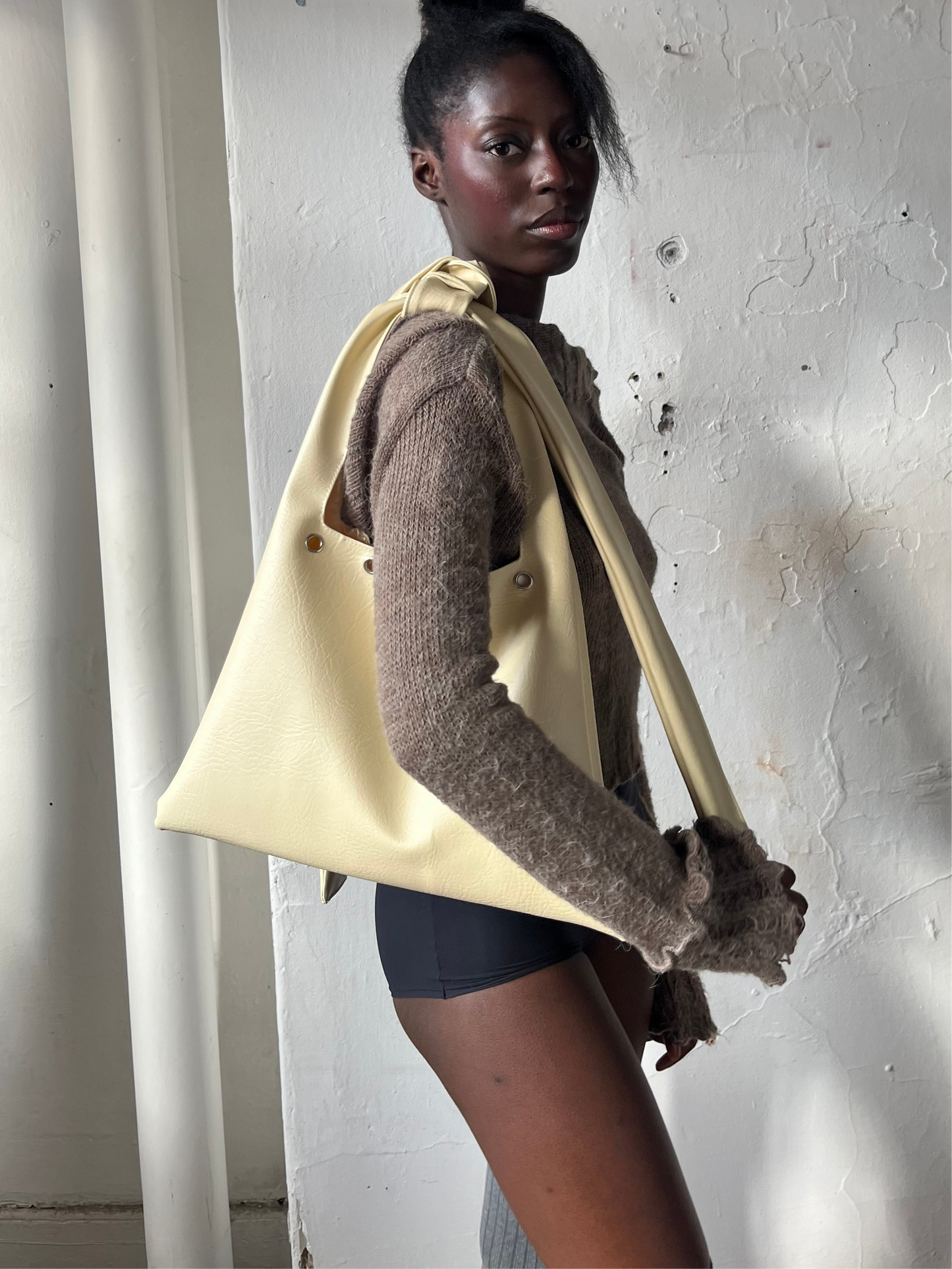 vanilla EYELET faux leather slouch bag